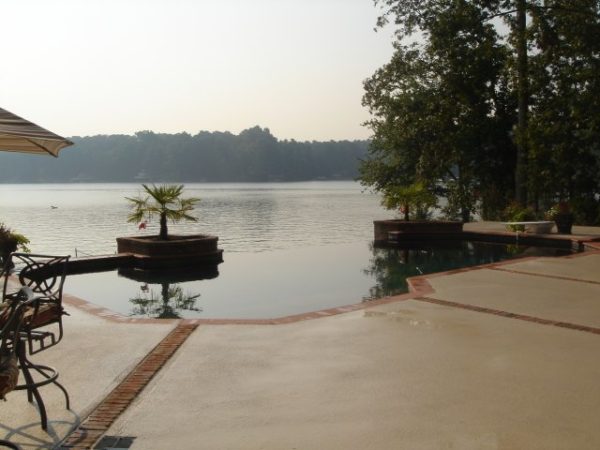 A stunning vanishing edge pool overlooking a serene lake.