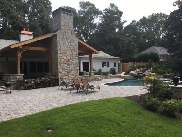 Luxury Outdoor Living Space with Fireplace Designed and Built by Georgia Classic Pool