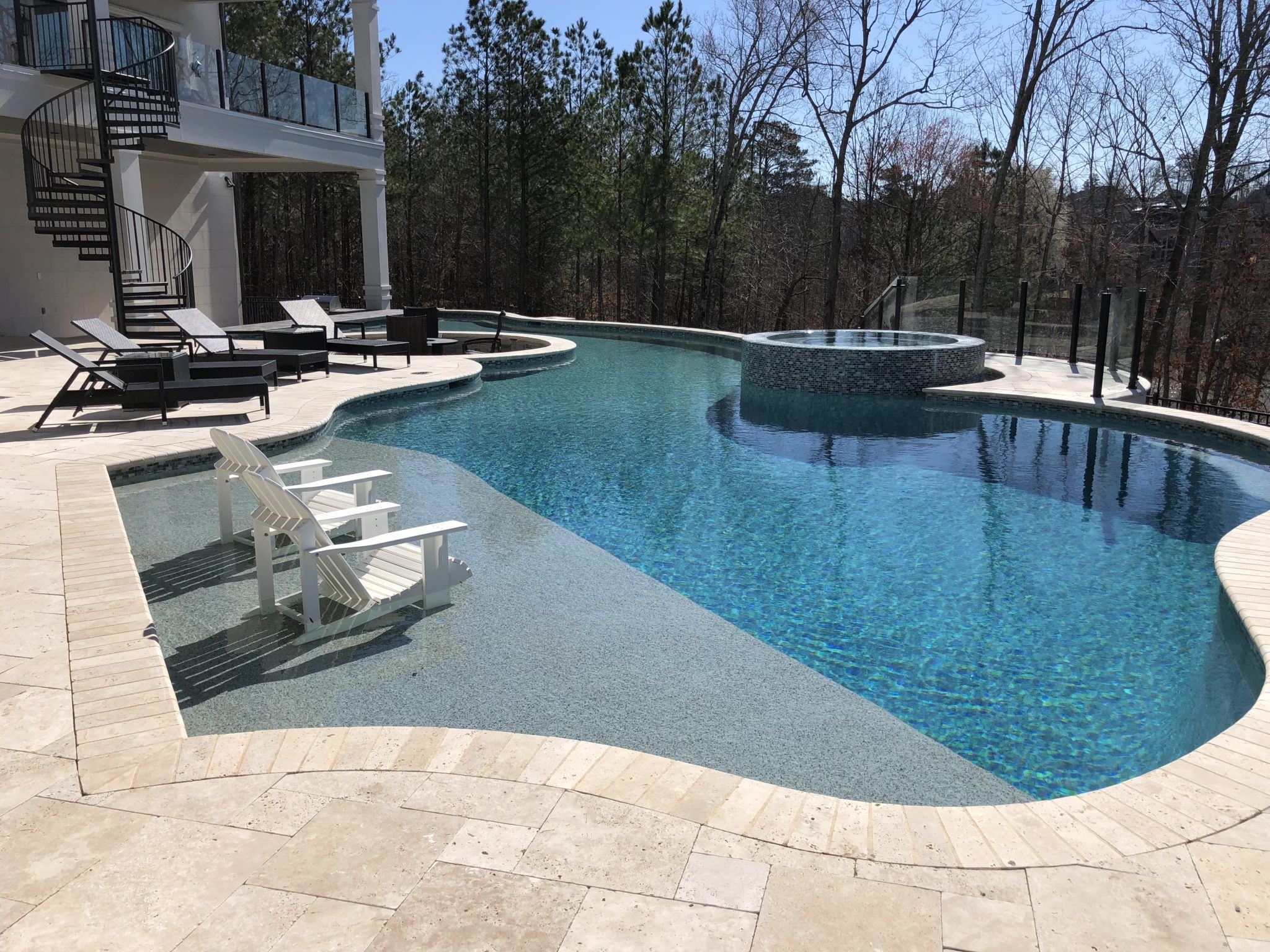 Aerial view of a custom modern freeform pool with clean lines and minimalist design.