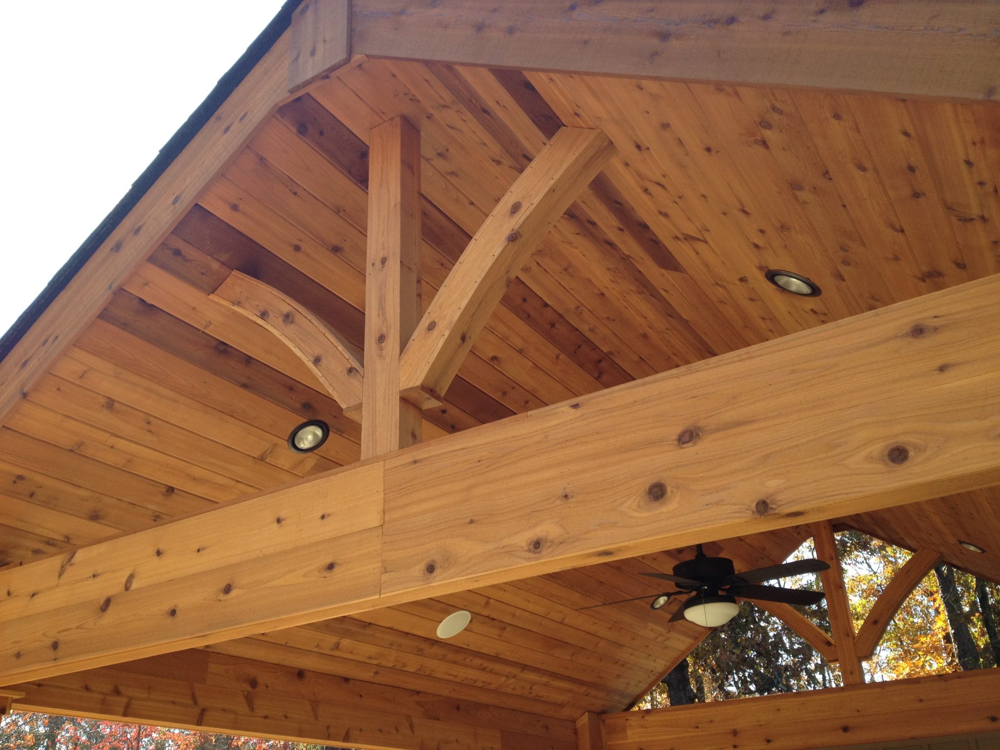 A beautifully crafted wood vaulted cabana providing a cozy retreat.