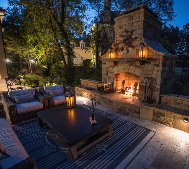 Patio With A Fireplace And A Table