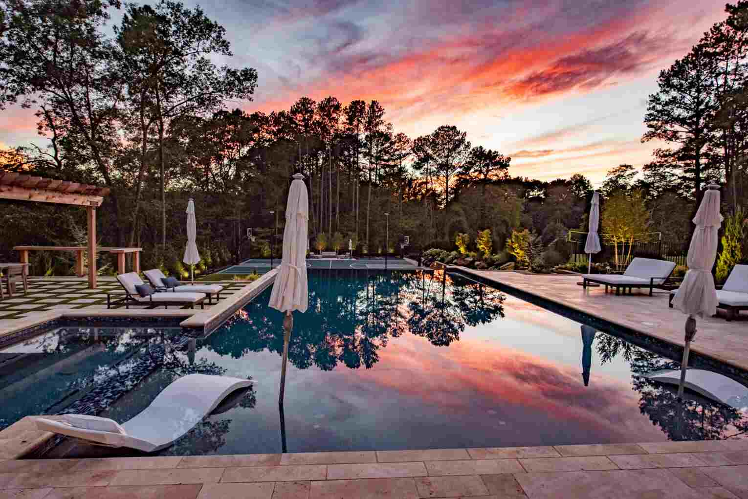 A Relaxing Pool With Comfortable White Chairs