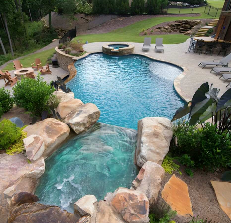 Luxurious Pool With Lounge Chairs In The Lawn