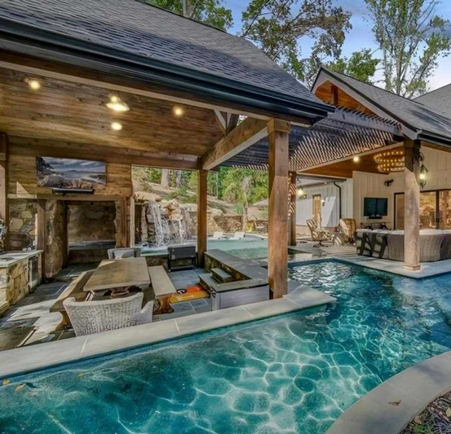 Pool And A House With A Covered Patio