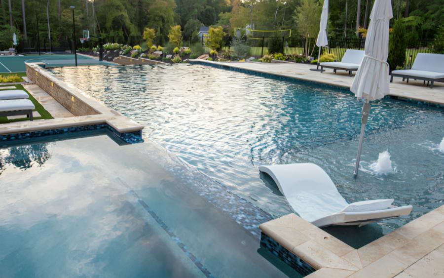 Pool With Deck Chairs And Umbrella