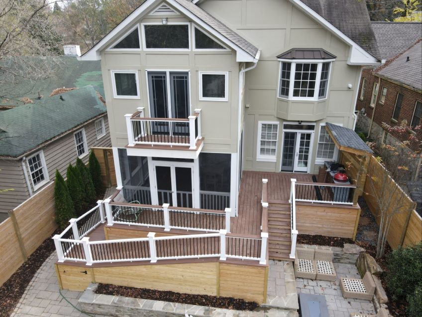 White Two Story House With Deck