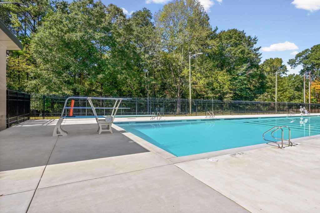 Diving board and swimming area at NH Scott Park public pool in DeKalb County, Georgia