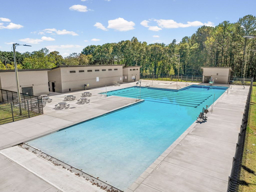 Wide view of NH Scott Park public swimming pool with lap lanes in DeKalb County, Georgia